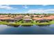 Aerial view of houses with pools, near a lake at 1048 Bradberry Dr, Nokomis, FL 34275