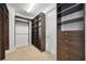 Large walk-in closet with custom built-in shelving and drawers at 1048 Bradberry Dr, Nokomis, FL 34275