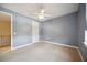Serene bedroom with neutral walls, ceiling fan and plush carpeting at 1048 Bradberry Dr, Nokomis, FL 34275