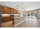 Kitchen with island, stainless steel appliances, and granite countertops at 1048 Bradberry Dr, Nokomis, FL 34275