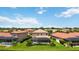 Aerial view of houses with pools, near a lake at 1048 Bradberry Dr, Nokomis, FL 34275