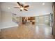 Open floor plan boasts a spacious kitchen and Gathering room with tile flooring at 1048 Bradberry Dr, Nokomis, FL 34275