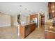 Open kitchen features a large island, stainless steel appliances, and views into the adjacent living area at 1048 Bradberry Dr, Nokomis, FL 34275