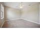 Bright bedroom with carpeted floor, ceiling fan, and ample closet space at 1048 Bradberry Dr, Nokomis, FL 34275