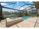 Enjoy this gorgeous pool and spa with screened-in patio at 1048 Bradberry Dr, Nokomis, FL 34275