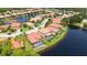 Aerial view of a house with pool, near a lake at 1048 Bradberry Dr, Nokomis, FL 34275
