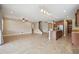 Open living area with tile floors and views into the kitchen at 1048 Bradberry Dr, Nokomis, FL 34275