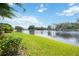 Enjoy the tranquil lake view from this spacious backyard at 1048 Bradberry Dr, Nokomis, FL 34275