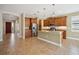 Open kitchen with island and stainless steel appliances at 1048 Bradberry Dr, Nokomis, FL 34275