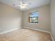 Simple bedroom with tile floors and ceiling fan at 1048 Bradberry Dr, Nokomis, FL 34275