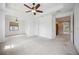 Main bedroom with carpet flooring and access to the bathroom and hallway at 1048 Bradberry Dr, Nokomis, FL 34275