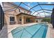 Inviting pool area with covered patio and view of home's exterior at 1048 Bradberry Dr, Nokomis, FL 34275