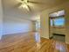 Bright living room with wood-look floors and access to kitchen at 4480 Ironwood Cir # 305A, Bradenton, FL 34209
