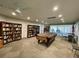 Community room with bookcases, pool table, and seating at 4480 Ironwood Cir # 305A, Bradenton, FL 34209