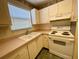 White cabinets and appliances in this well-lit kitchen at 4480 Ironwood Cir # 305A, Bradenton, FL 34209