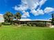 Community clubhouse with landscaping and walkway at 4480 Ironwood Cir # 305A, Bradenton, FL 34209