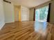 Spacious bedroom with wood-look floors and sliding glass doors to balcony at 4480 Ironwood Cir # 305A, Bradenton, FL 34209