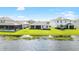 Aerial view of home with lake access and solar panels at 12665 Promenade Estates Blvd, Sarasota, FL 34238
