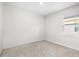 Simple bedroom with neutral walls and carpet at 12665 Promenade Estates Blvd, Sarasota, FL 34238