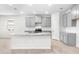 Modern kitchen with gray cabinets and granite countertops at 12665 Promenade Estates Blvd, Sarasota, FL 34238