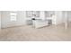 Open dining area with kitchen island and view to living room at 12665 Promenade Estates Blvd, Sarasota, FL 34238