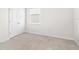 Empty bedroom with neutral walls and carpet at 12665 Promenade Estates Blvd, Sarasota, FL 34238