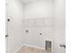 Laundry room with shelving and hookups at 12665 Promenade Estates Blvd, Sarasota, FL 34238