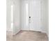 Bright entryway with tile flooring and white door at 12665 Promenade Estates Blvd, Sarasota, FL 34238