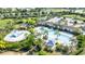 Resort-style community pool with a playground and lounge area at 12665 Promenade Estates Blvd, Sarasota, FL 34238
