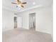 Bright bedroom with carpet, ceiling fan and access to bathroom at 12665 Promenade Estates Blvd, Sarasota, FL 34238