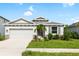 Charming one-story house with gray exterior and stone accents at 12665 Promenade Estates Blvd, Sarasota, FL 34238