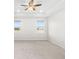 Spacious bedroom with carpeting, ceiling fan, and lake view at 12665 Promenade Estates Blvd, Sarasota, FL 34238