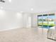 Spacious living room with sliding doors to pool area at 12665 Promenade Estates Blvd, Sarasota, FL 34238