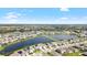 Aerial view of houses and lake in a residential neighborhood at 12665 Promenade Estates Blvd, Sarasota, FL 34238