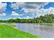 Stunning view of a peaceful lake with lush green landscape at 9861 50Th Street E Cir, Parrish, FL 34219