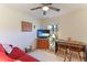 Home office with a comfortable sofa, work desk, and large window at 9861 50Th Street E Cir, Parrish, FL 34219