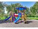 playground with slides, climbing structures, and shaded areas at 9861 50Th Street E Cir, Parrish, FL 34219