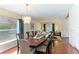 Elegant dining room features a wood table, chandelier, and hardwood floors at 9861 50Th Street E Cir, Parrish, FL 34219