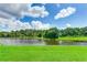 Peaceful waterfront property with a scenic view of the lake at 9861 50Th Street E Cir, Parrish, FL 34219