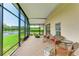 Spacious screened porch overlooking a tranquil lake at 9861 50Th Street E Cir, Parrish, FL 34219