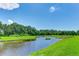 Serene waterfront view with lush greenery and calm waters at 9861 50Th Street E Cir, Parrish, FL 34219