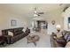 Open concept living room with views into the kitchen and dining area at 9861 50Th Street E Cir, Parrish, FL 34219