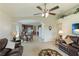 Open concept living room with a view into the kitchen and dining area at 9861 50Th Street E Cir, Parrish, FL 34219