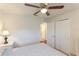 Bright bedroom with a queen bed and double doors leading to the bathroom at 9861 50Th Street E Cir, Parrish, FL 34219