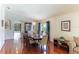 Bright dining room with hardwood floors and elegant chandelier at 9861 50Th Street E Cir, Parrish, FL 34219