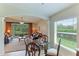 Breakfast nook with glass-top table and view of living room at 9861 50Th Street E Cir, Parrish, FL 34219