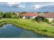 Home with covered patio overlooking a lake at 2508 Avolet Ct, Bradenton, FL 34211