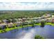 Gorgeous aerial perspective featuring homes with scenic waterfront views in a desirable neighborhood at 11492 Dancing River Dr, Venice, FL 34292