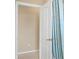 Bathroom interior with a partial view of a shower with a seashell-themed shower curtain at 11492 Dancing River Dr, Venice, FL 34292