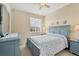 Charming blue bedroom featuring a bed, dresser, and a cozy nautical theme at 11492 Dancing River Dr, Venice, FL 34292
